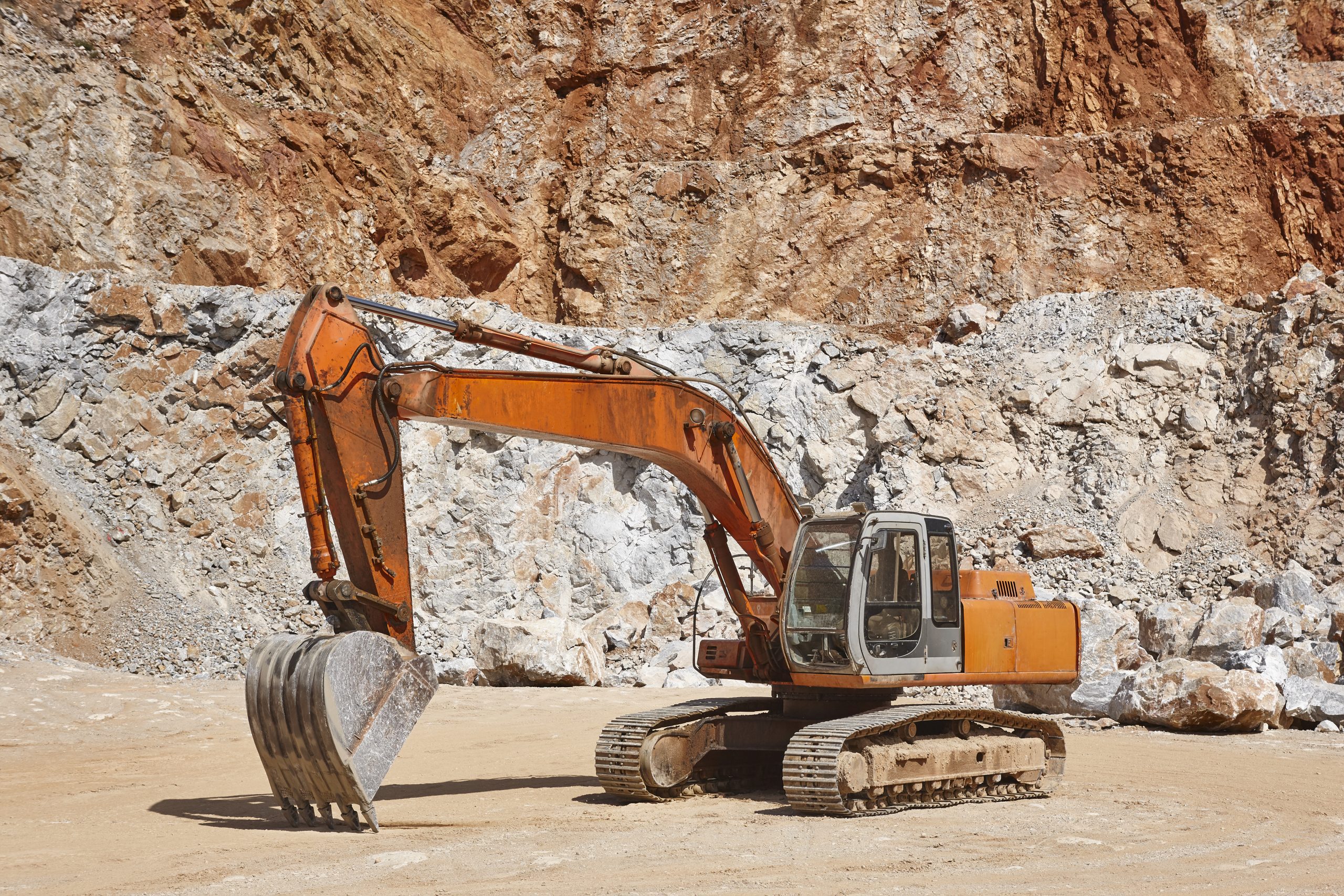 Heavy excavator on a quarry. Excavation machinery. Earthmover wo